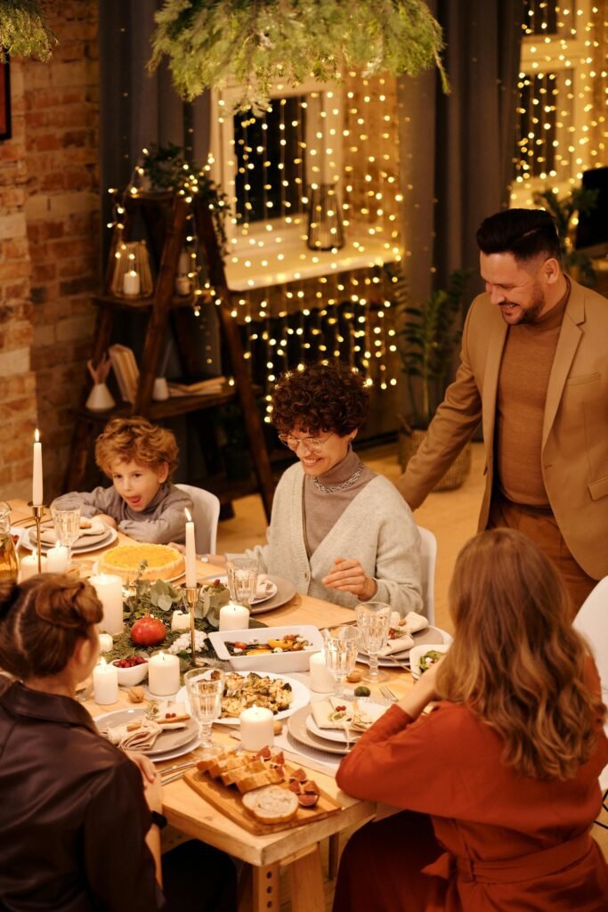 alt="Image of happy people eating"