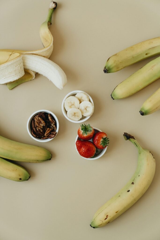 alt="Image of bananas and strawberries"