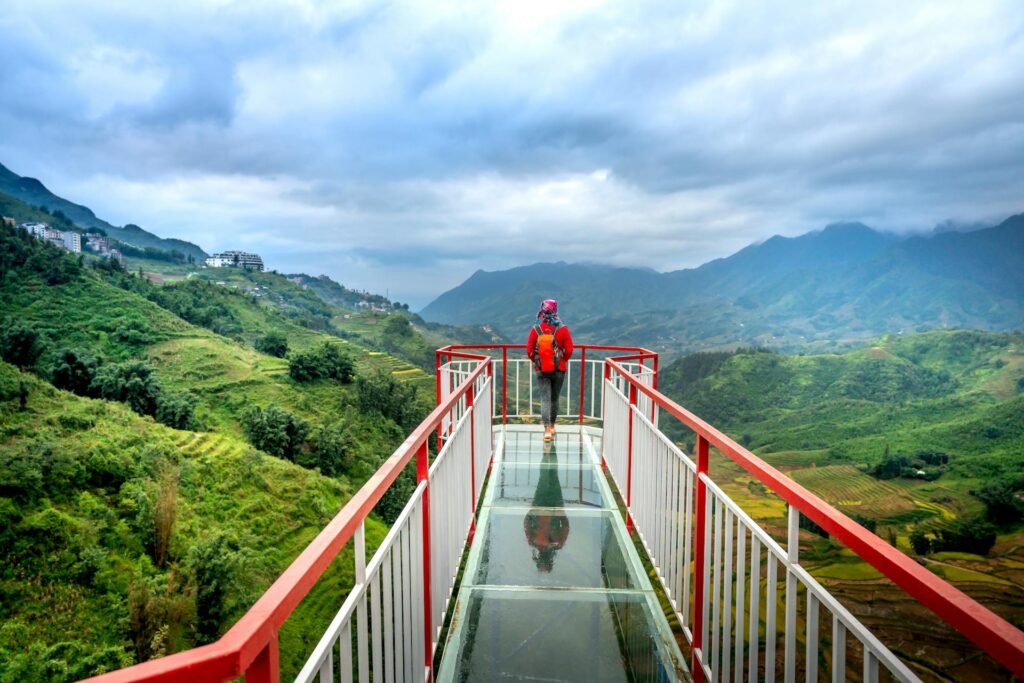 alt="Picture of Backpacker on a glass cliff"