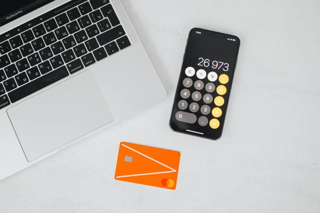 alt="Picture of Laptop credit card and smartphone"