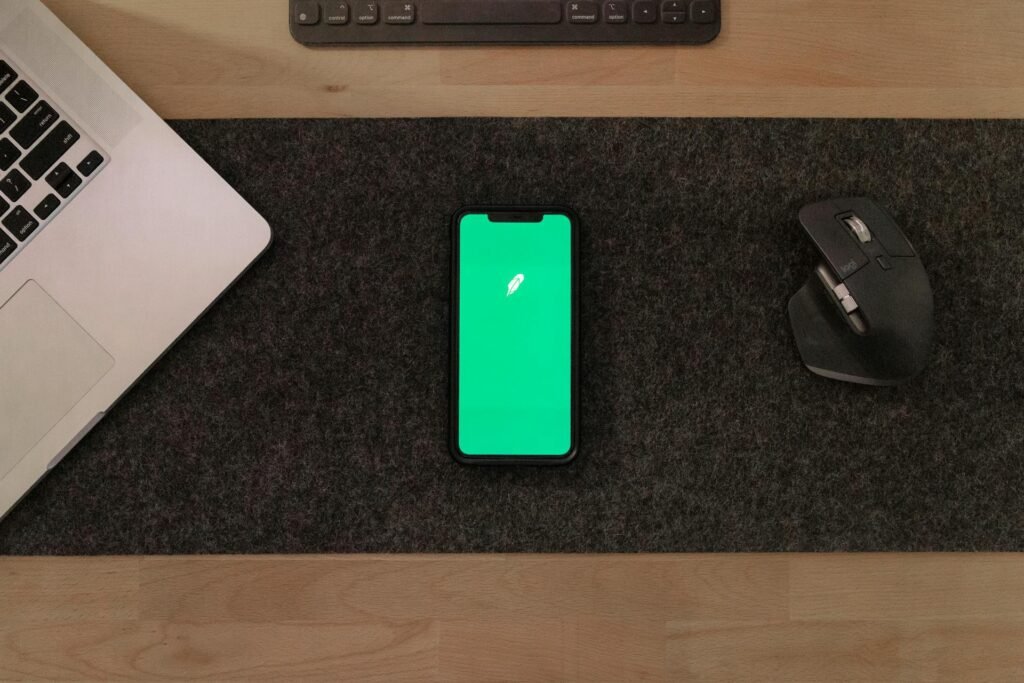 alt="Picture of Laptop smartphone with green screen"