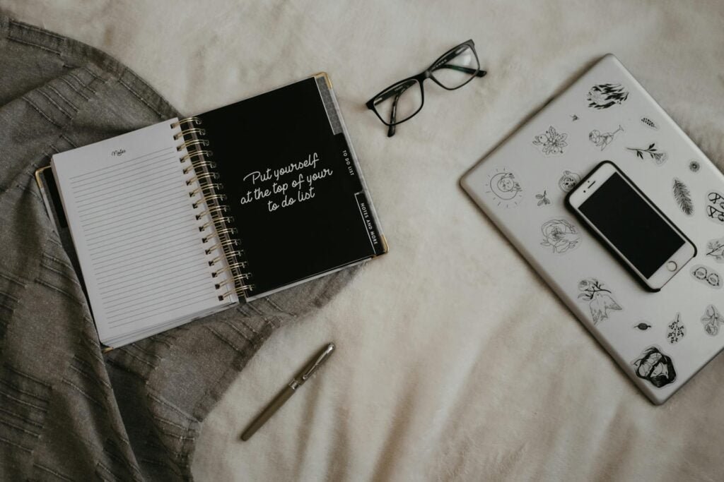 alt="Picture of Notebook laptop and smartphone on top"