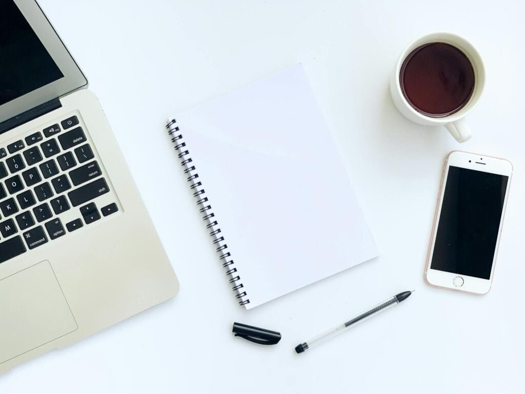 alt="Picture of Notebook smartphone laptop and coffee"