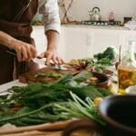 alt="Picture of person cutting vegetables"