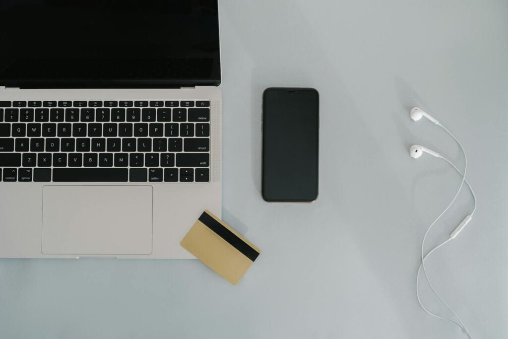 alt="Picture of Smartphone credit card open laptop"
