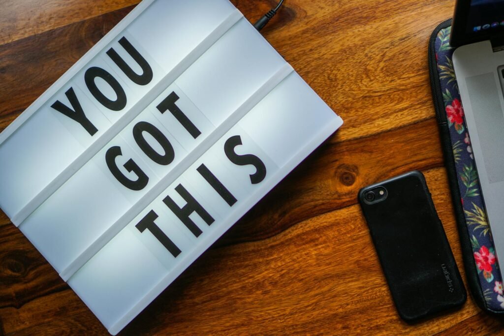 alt="Picture of Smartphone laptop and sign"
