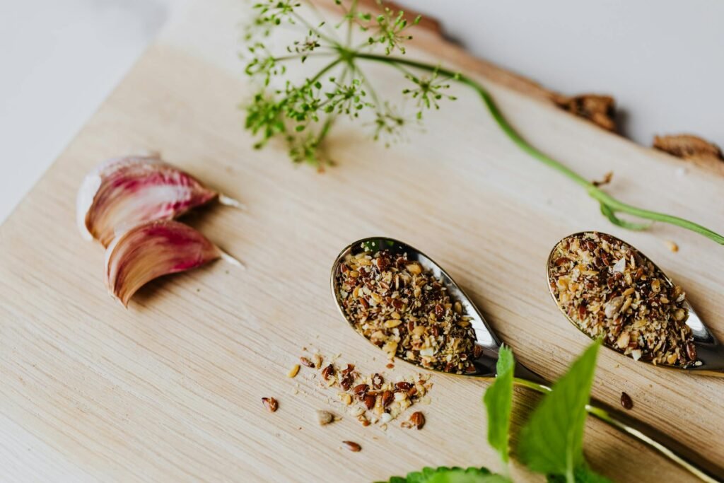 alt="Image of Spices and herbs in spoons"