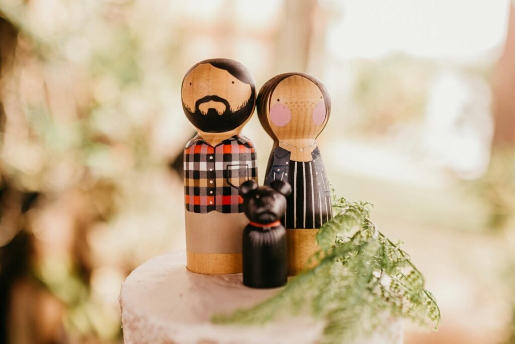 alt="Picture of Woman and man figurines"