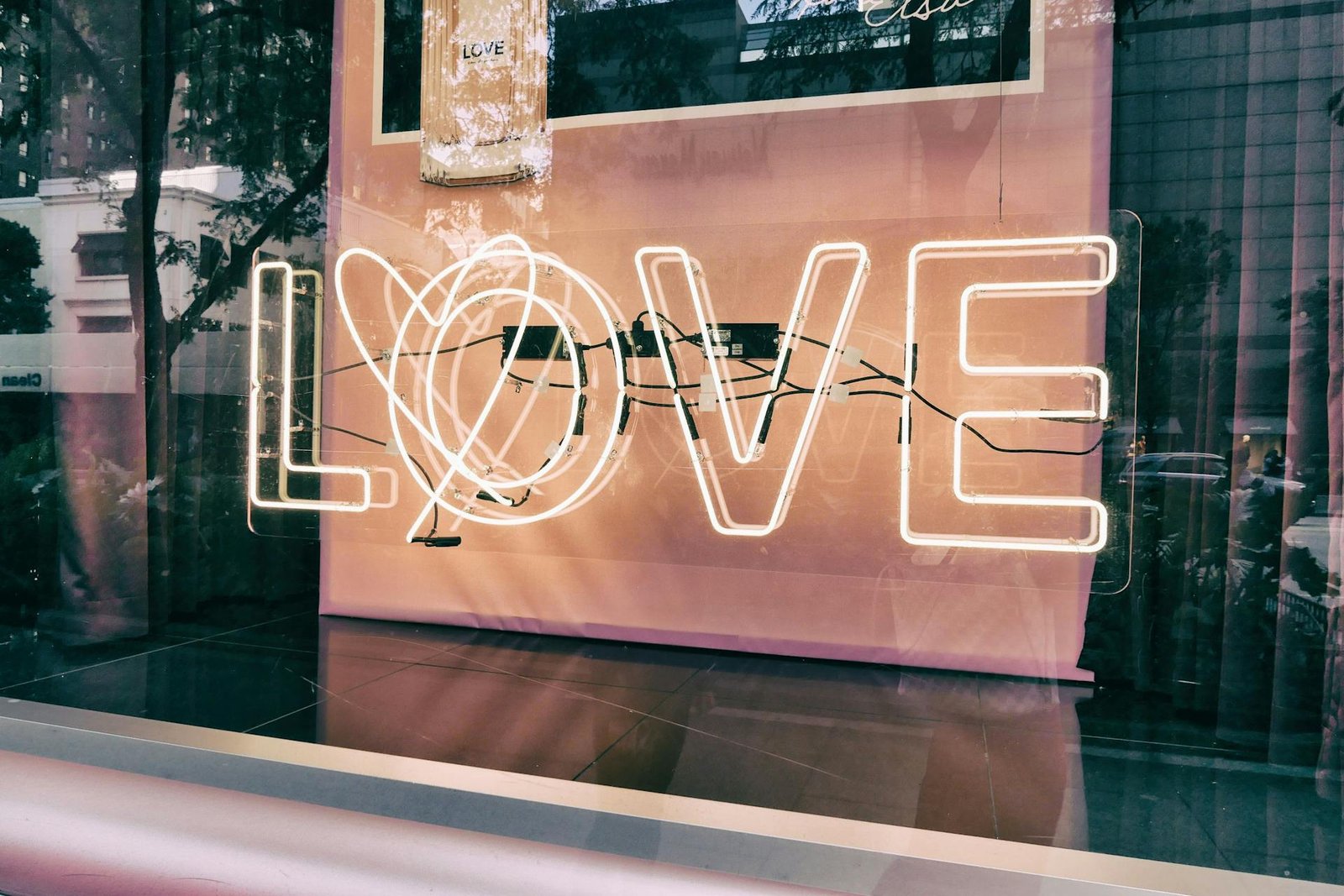 alt=”Image of Neon sign with love written on it”