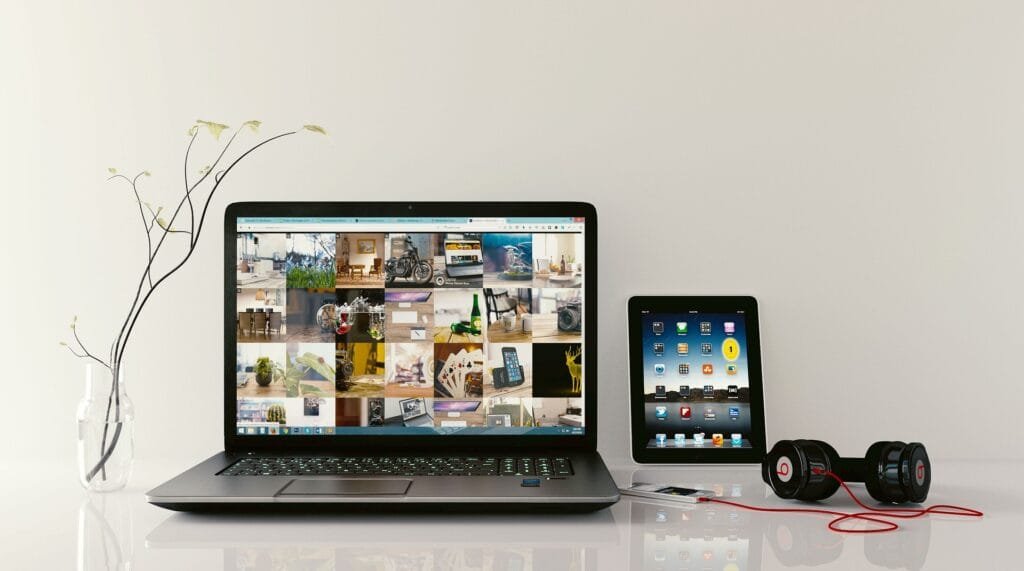 alt="Image of Open laptop tablet and phone"