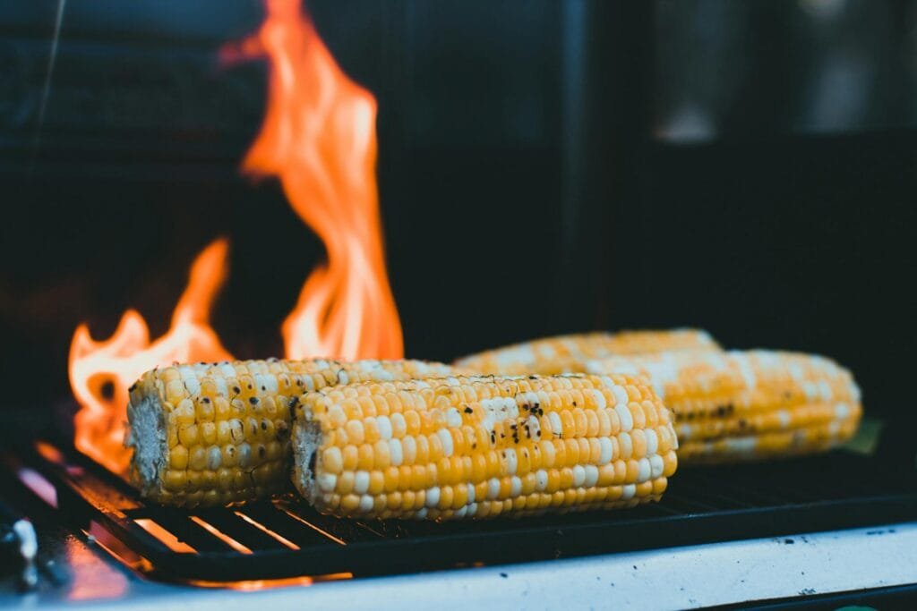 alt=”Image of Roasting corn on fire”