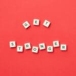 alt=”Image of Tiles with get stronger spelled out”