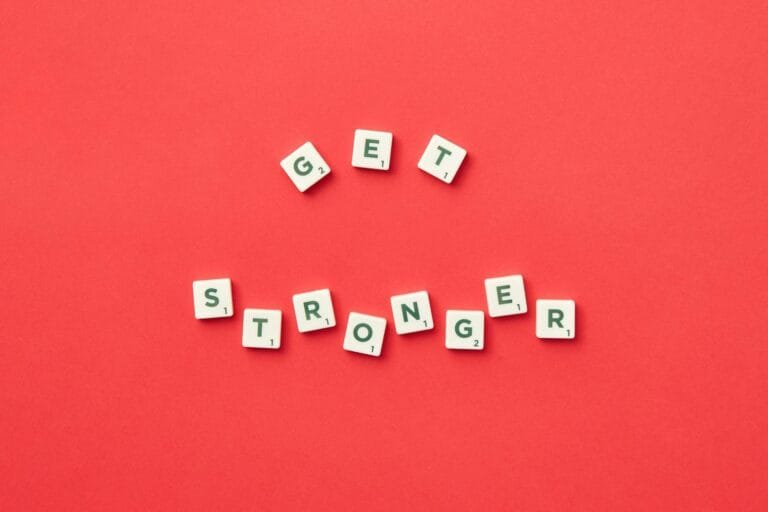 alt=”Image of Tiles with get stronger spelled out”