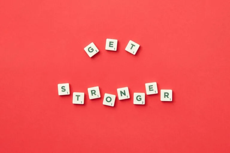 alt=”Image of Tiles with get stronger spelled out”