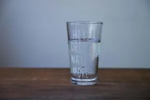 alt=”Image of Water glass with drink water more written on the side”