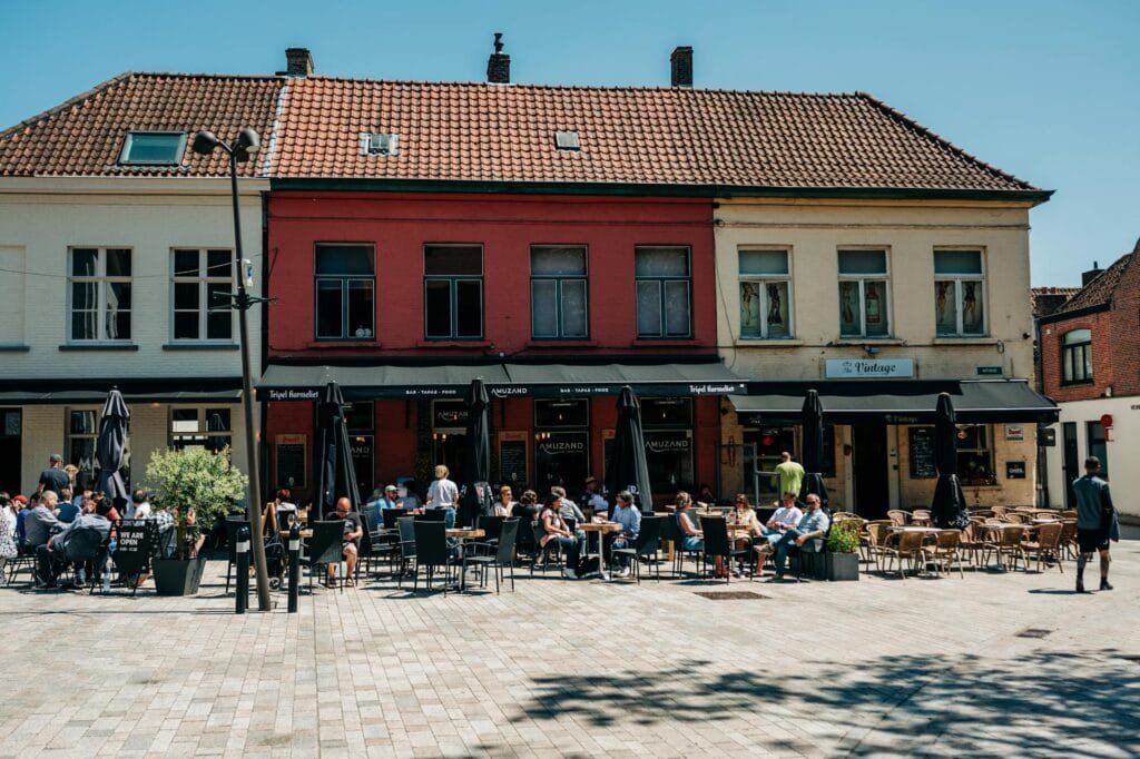 alt=”Image of People eating outside restaurants”