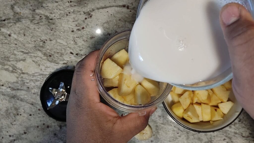 alt="Adding Almond Milk to blender"