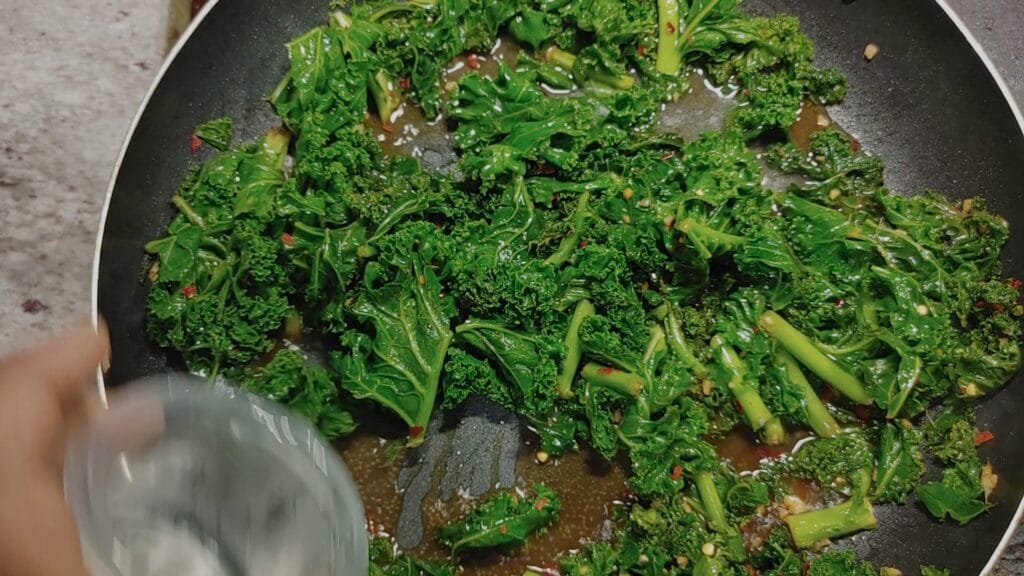 alt="adding water to frying pan"