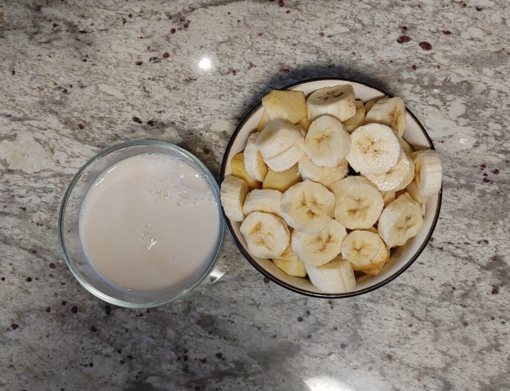 alt="Bowl next to Almond Milk"