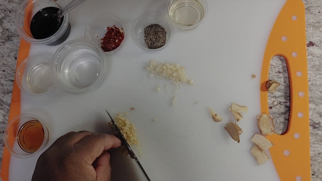 alt="Chopping Galic and Ginger "