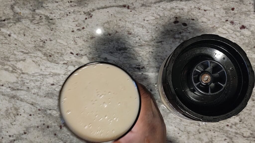 alt"Grabbing cup of smoothie"