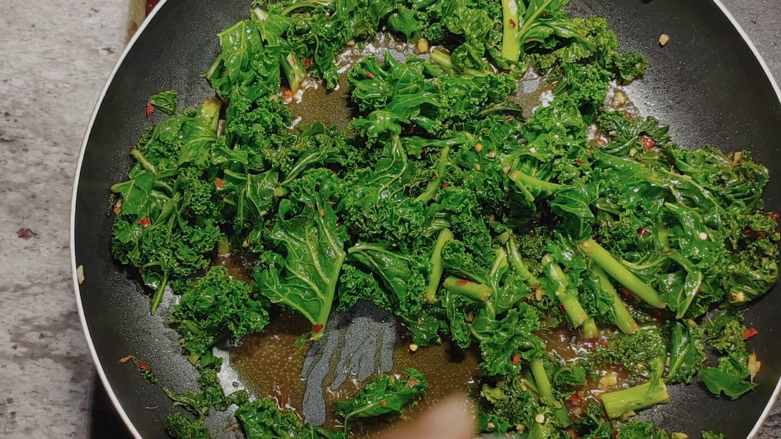 alt="Kale Stir frying in pan"
