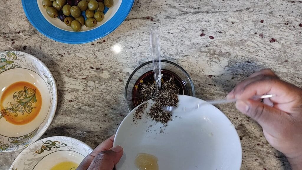alt="Adding Black Pepper to bowl"