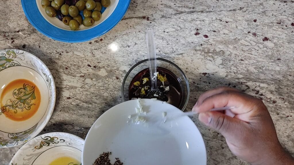 alt="Adding Garlic to bowl"