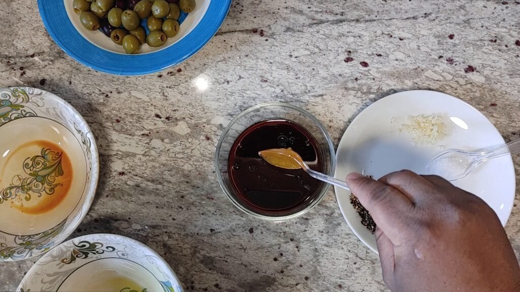 alt="Adding Honey to bowl"