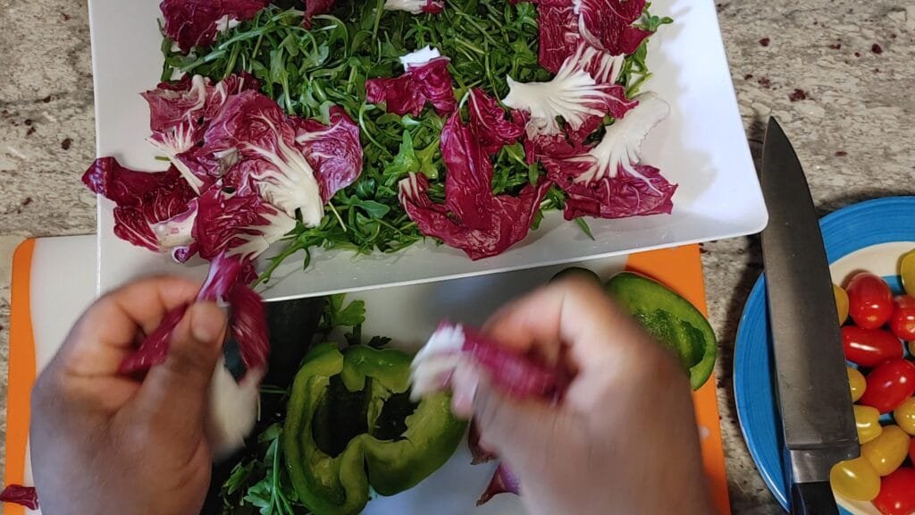 alt="Adding Radicchio in a bowl"