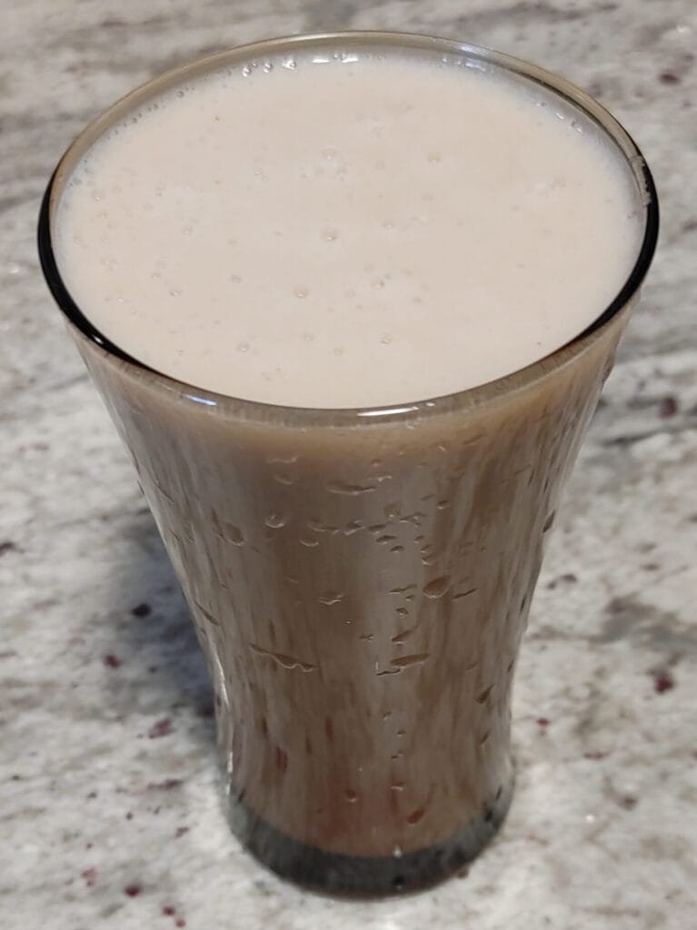 alt="Almond Milk in A Glass"