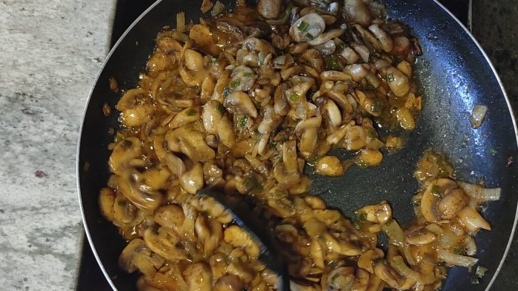 alt="Browning Sauteed Mushrooms in pan"