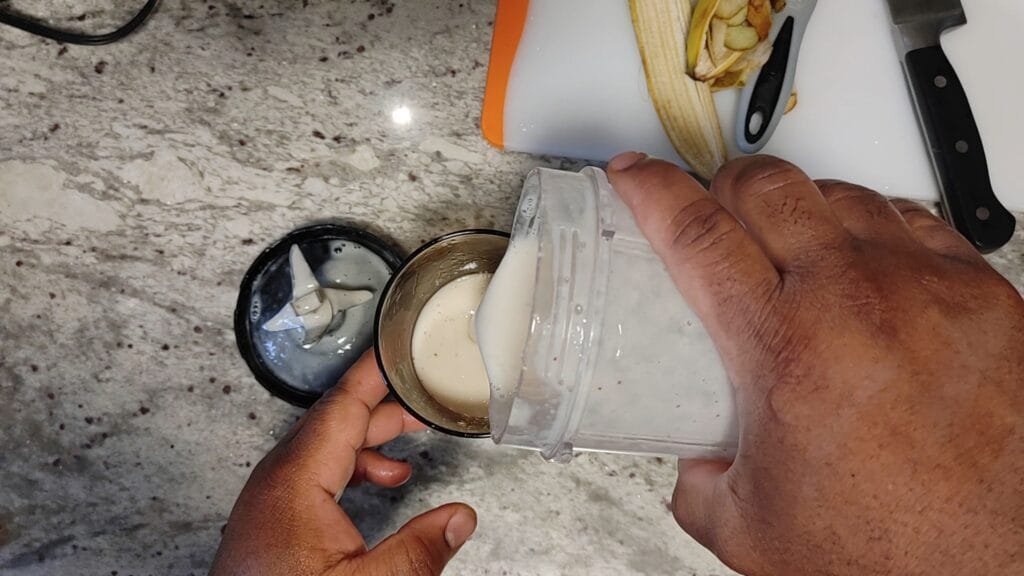 alt="Pouring Smoothie"
