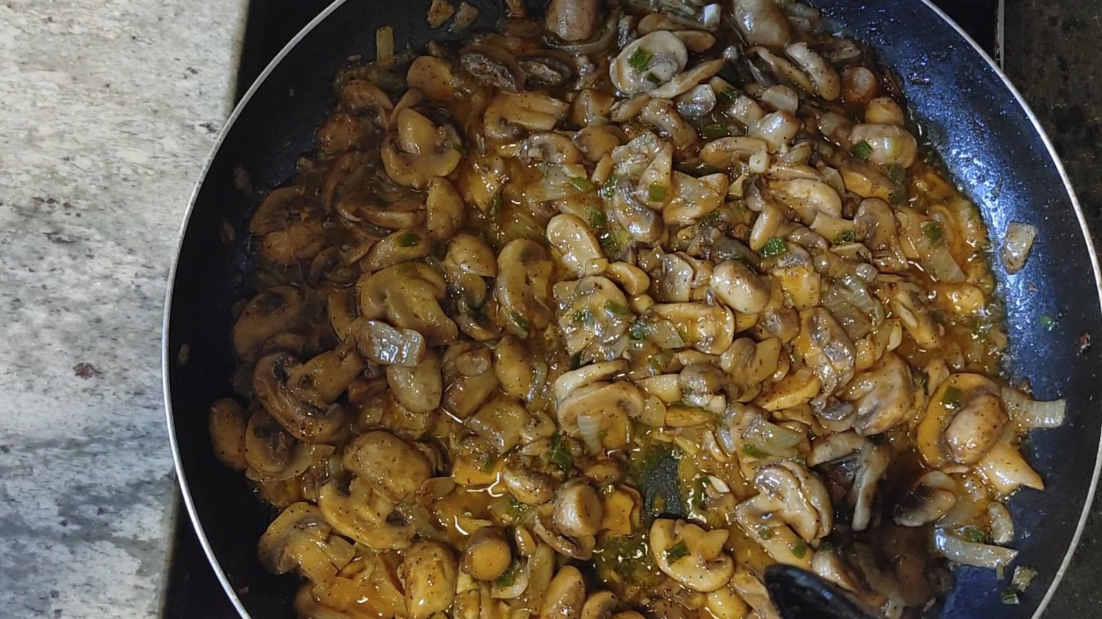 alt="Sauteed Mushrooms in pan"