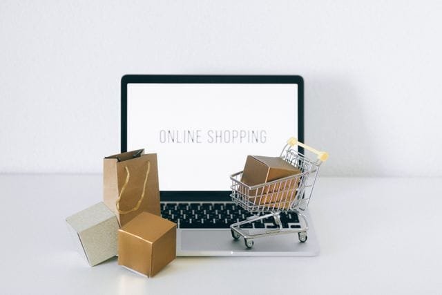 alt="Online Shopping Computer and Cart"