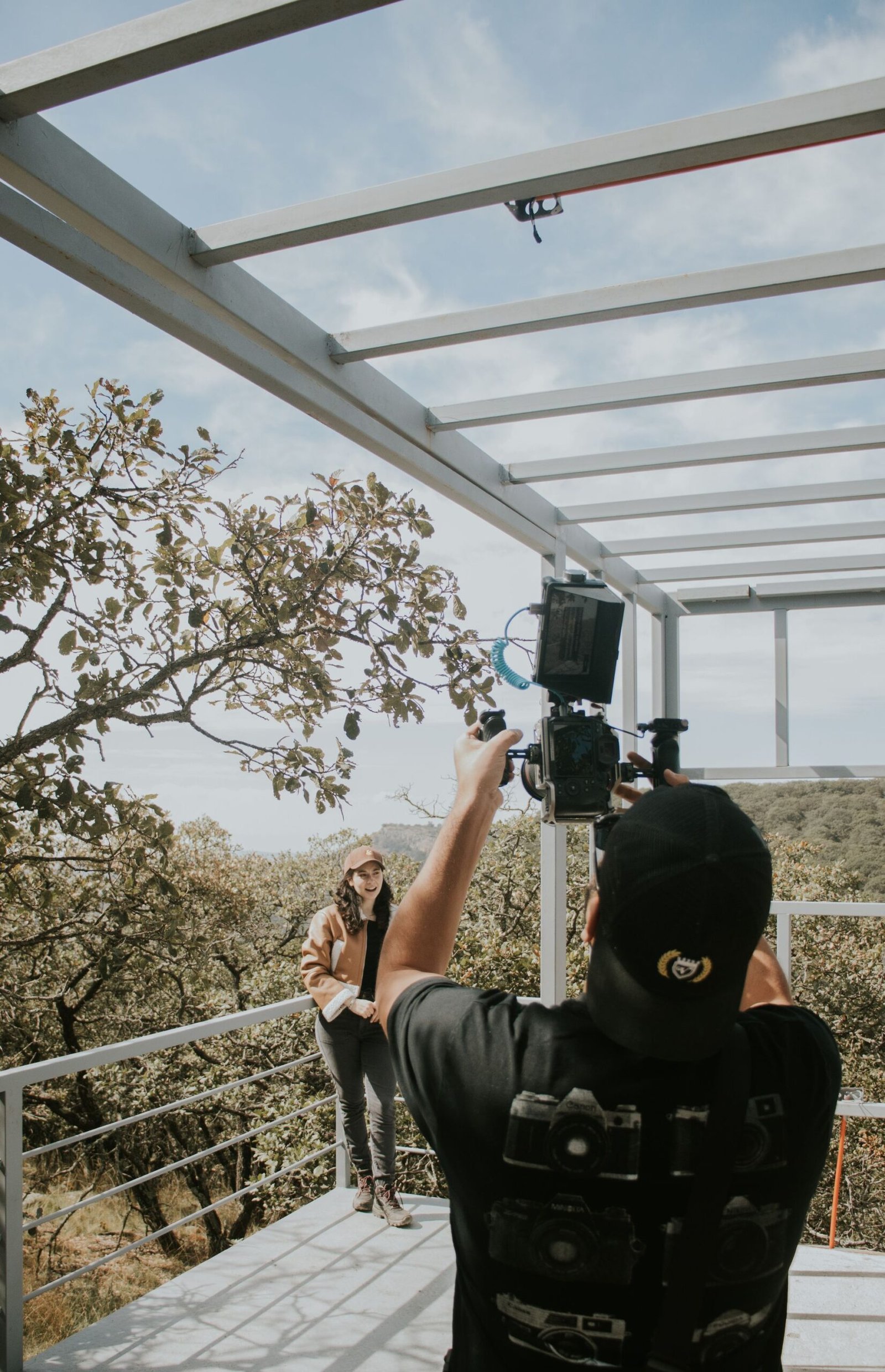 alt="Filming Person Outdoor"