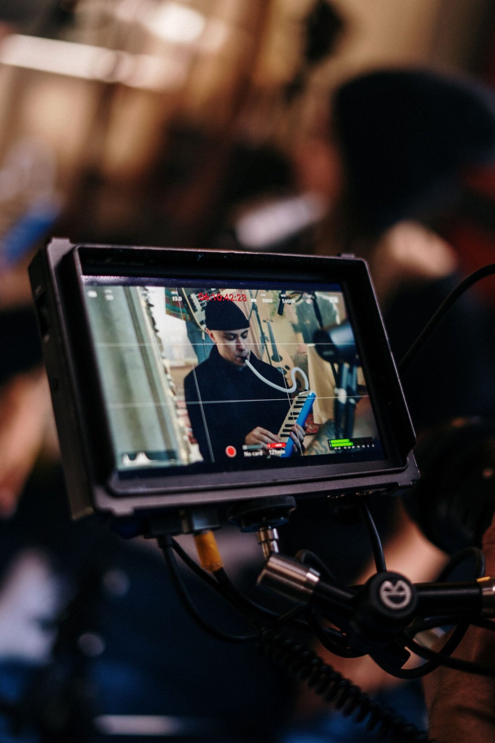 alt="Filming Person playing mouth Organ"